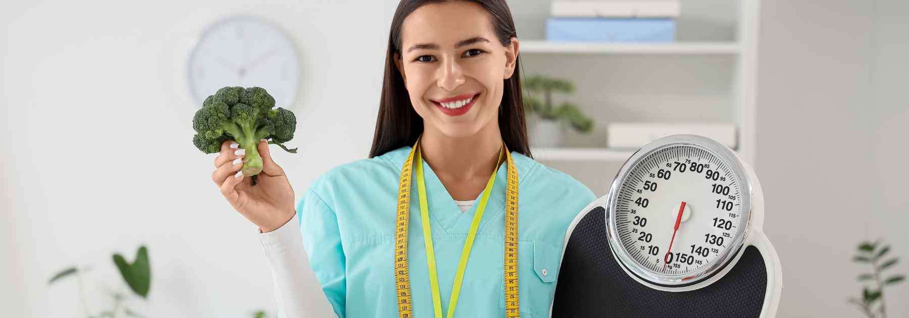 doctor holding broccoli and weighing scale